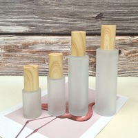 Pots en verre dépoli personnalisés recharge de lotion pour soins de la peau transparente couvercle de grain de bois pots en verre de crème au beurre pour cosmétique en vente en vrac