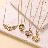 Collier pendentif ailes d'ange Huibao pour femme, pavé de zircons cubiques transparents, avec breloque cœur rose, plaqué or 18 carats, bijoux de cou, vente en gros