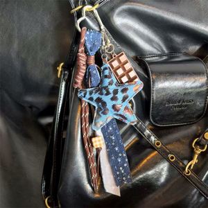 Llavero de Cuero de Lujo Ligero con Estrella de Cinco Puntas, Accesorio para Bolso, Colgante Creativo con Cuerda Trenzada - Product Image 6