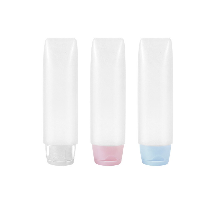 Tubo transparente con tapón rosa.