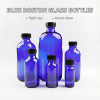 Flacon pulvérisateur de parfum cylindrique en verre bleu Boston de 15 ml avec bouchon à vis en cobalt et diffuseur d'huiles essentielles en plastique noir sérigraphié