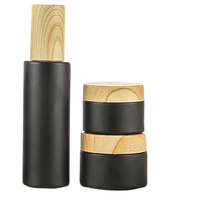 Flacon pompe cosmétique en verre sans air noir mat avec couvercle en bambou 80ml 100ml 120ml – Emballage en verre à épaulement plat