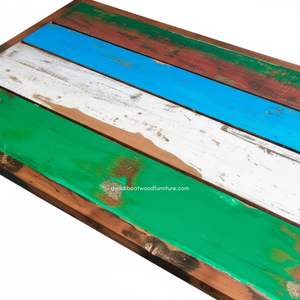 Fabricada con madera de teca duradera, esta mesa de exterior de 120x70x78 cm presenta un diseño rústico, que aporta elegancia natural y robustez. - Product Image 2