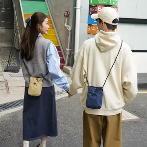 2026 四季百搭情侣时尚品牌休闲简约潮流单肩斜挎手机包格子图案 - Product Image 6