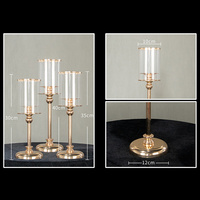 Ensemble de 3 bougeoirs dorés glamour, tubes coupe-vent à silhouette décalée, base large polie, style vintage rustique