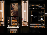 Présentoir suspendu rond en verre LED haut de gamme pour boutique de parfums et îlot de présentation de parfums pour boutique de fragrances de luxe