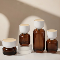 Luxuriöses Bernsteinfarbenes Lichtundurchlässiges Glas-Hautpflegeset 30ml 50ml 100ml 120ml Lotion-Serum-Pumpflasche Kosmetikverpackung 30g 50g Cremedose
