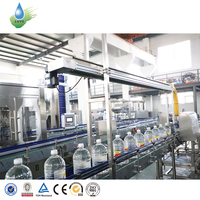 Machine de remplissage automatique électrique de boissons en PET 5L haute précision avec pompe PLC et structure rotative pour ligne de production de bouteilles