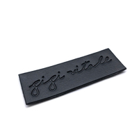 Étiquettes en cuir véritable jeans personnalisées Étiquettes en cuir noir avec logo en relief souple