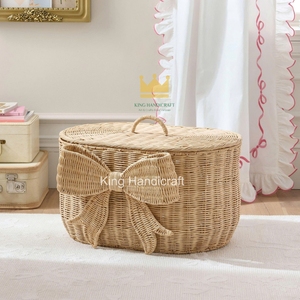 Panier de rangement en rotin à prix abordable, forme ovale avec poignée en forme de nœud, organisateur de vêtements artisanal pour le salon - Product Image 1