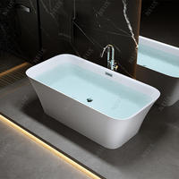 Baignoire autoportante rectangulaire moderne en acrylique blanc avec drain central pour la rénovation d'hôtels et de villas