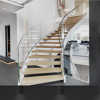 Escalier courbé sur mesure OEM avec design contemporain, marches en bois/métal/marbre et diverses options de balustrades pour l'intérieur