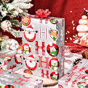 Christmas gift wrapping <b>paper</b> featuring cartoon Santa Claus and snowman <b>patterns</b> with back cut edges Customizable - Product Image 1