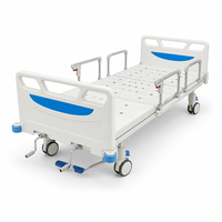 Lit médical manuel 2 fonctions avec tête de lit ABS, rail rabattable en polypropylène, descente à fermeture douce, capacité 170 kg, verrouillage central, roulettes