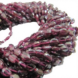 Cuentas de granate natural, forma ovalada, facetadas, de 5 a 7 mm, en hilo de 13 pulgadas de largo. - Product Image 1