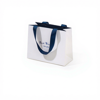 Sac en papier de luxe coloré avec logo personnalisé, emballage pour bijoux, sac cadeau en papier kraft avec poignées en ruban