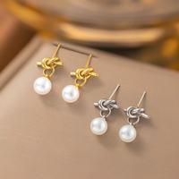 Pendientes de acero inoxidable para mujer con colgante de perla en forma de corazón y circonia y diseño geométrico.