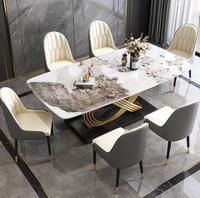 Table de salle à manger en acier inoxydable au design minimaliste de luxe avec chaises Table en marbre moderne pour bar