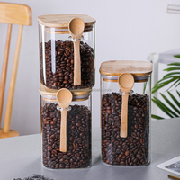 Vente en gros de pots en verre borosilicate transparent de qualité supérieure, carrés, avec couvercle en bambou et cuillère, hermétiques, pour le stockage d'épices, de sel, de bonbons, de noix