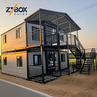 Villa préfabriquée de luxe à deux étages, maison conteneur extensible de 20 pieds sur 40 pieds avec escalier et toit en pente pour les États-Unis, l'Australie et le Canada