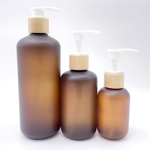 Ensemble d'emballages cosmétiques en bambou, pot à crème 150 ml 250 ml, flacon de shampooing en plastique PET ambré givré 120 ml 250 ml 500 ml avec pompe en bambou - Product Image 1