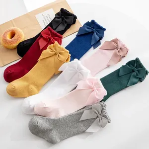 Venta caliente Legger Warmer Calcetines para bebés recién nacidos con Lazo de terciopelo Invierno Algodón Niños Calcetines hasta la rodilla Calcetines para niñas