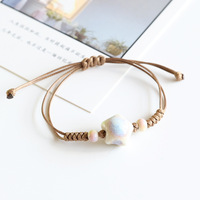 Bracelet de couple en céramique colorée en forme d'étoile de mer, bracelet en corde tressée de couleur café, perles en céramique, cadeau pour homme et femme