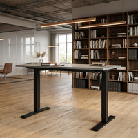 Table minimaliste moderne à hauteur réglable électriquement par un seul moteur, avec pieds télescopiques à 2 niveaux, barre stabilisatrice en acier massif et commande ergonomique.