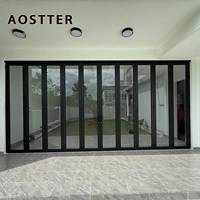 Porte pliante en aluminium AOSTTER à cadre noir robuste avec double vitrage isolant et verrouillage multipoints pour une utilisation haut de gamme dans les salles à manger
