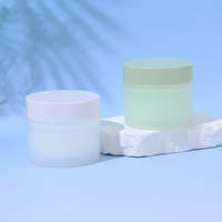 Flacon de crème personnalisé en verre givré semi-transparent avec bouchon coloré macaron pour l'emballage des soins de la peau
