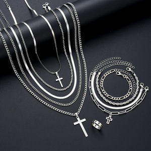 HZS-70 Juego de Joyería de Moda Plateada para Mano, Dedo y Cuello, Elegante Juego de Pulsera, Anillo y Collar de Acero Inoxidable con Cruz para Mujeres y Chicas - Product Image 1
