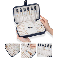 Étui de voyage pour bijoux bleu marine avec boutons-pression, miroir, sangles pour colliers, emplacements pour bagues, porte-cartes pour boucles d'oreilles, intérieur en velours, boîte cadeau