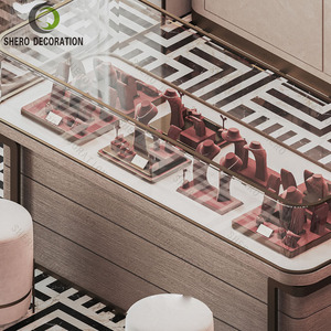 Luxury Brushed <b>Gold</b> Glass Jewellery Shop Counter Red Jewelry Display Cabinet For Boutique Jewelry Shops Interior Design - Product Image 3