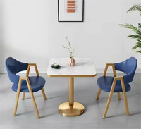 Ensemble table et chaises de salle à manger de l'usine de Foshan meubles commerciaux de restaurant en cuir massif en bois inoxydable sur mesure