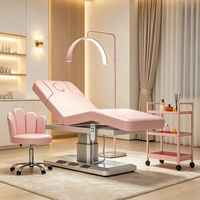 Table de massage électrique rose réglable pour spa avec trou facial et lumière LED, idéale pour salon de beauté (OEM)