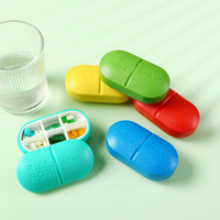 Boîte à pilules de voyage portable en plastique à 6 compartiments avec logo personnalisé / Étui de rangement en forme de capsule