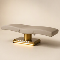 Table de soin électrique à 3 moteurs, design monobloc, colonne dorée brossée, base LED, personnalisable pour salon, spa, traitement facial, clinique