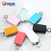 Cargador portátil promocional M-Queen Gift Mobile de 2000mah/4000mah OEM, mini batería externa con llavero, cable integrado y LED.