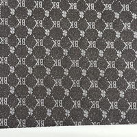 Tissu en denim jacquard noir et gris avec logo rétro en lettres pour vêtements, vestes et sacs