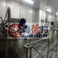 Centrífuga de descarga inferior con raspador vertical, especialmente diseñada para materiales inflamables y explosivos de alta viscosidad y granulación fina.