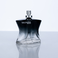 Nouveau design de bouteille de parfum en verre de 100ml de forme unique avec dégradé noir de luxe avec pulvérisateur