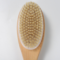 Brosse de douche double face en bois de lotus laqué avec poils de sanglier et nylon, bandes antidérapantes bleues et cordon de suspension blanc
