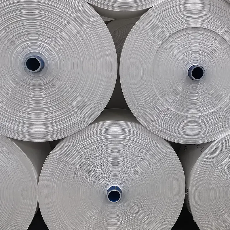 ม้วนผ้าท่อโพรพิลีน Pp ผ้า PP 100% สําหรับถุงจัมโบ้ ผ้าเคลือบในโรงงานม้วนขาย