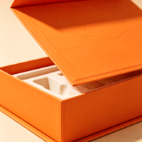 Flip magnétique personnalisé  Coffret cadeau cosmétique haut de gamme en carton rigide orange avec pré-remplissage  Insert en mousse EVA découpé sur mesure pour emballage de kit de soins de la peau OEM ODM
