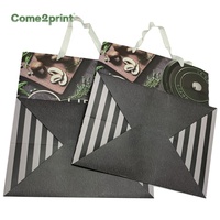 Sac à provisions cadeau d'emballage de vêtement en papier de luxe avec logo de marque personnalisé sac en papier avec poignée en ruban