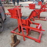 Machine de fabrication de briques en terre argileuse rouge à emboîtement manuel machine à blocs de terre en briques compressées avec logo en argile de petite taille