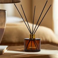 Bouteille de diffuseur de parfum en verre rond ambré de luxe vide de 150 ml avec couvercle doré à vis et bâtonnets