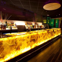 Fournisseurs de meubles de bar OEM Comptoir de bar de luxe en marbre Corians d'onyx jaune avec éclairage à LED