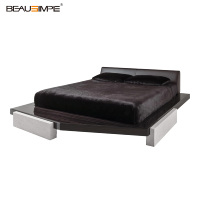 Lit de luxe discret et confortable en placage de bois d'ébène foncé avec base en pierre de béton et tête de lit entièrement en cuir – Gamme résidentielle haut de gamme