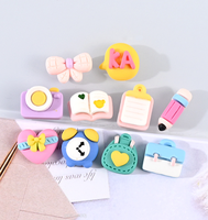 En gros : Breloques en résine, stylos, appareils photo de dessin animé, breloques à la colle crème, accessoires en résine pour pinces à cheveux, bracelets et colliers DIY